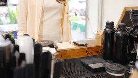 Small business entrepreneur barista coffee shop cafe restaurant. Customer tap credit card on card swipe machine making online banking payment buy coffee at cashier counter. Cashless payment technology - Powered by Shutterstock - Get 15% off with code: PIKWIZARD15