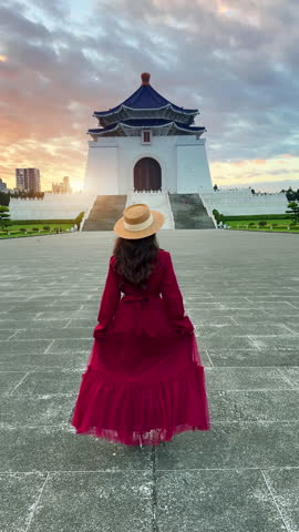 Vertical. Asian woman walking at Chiang Kai Shek Memorial Hall in Taipei, Taiwan.