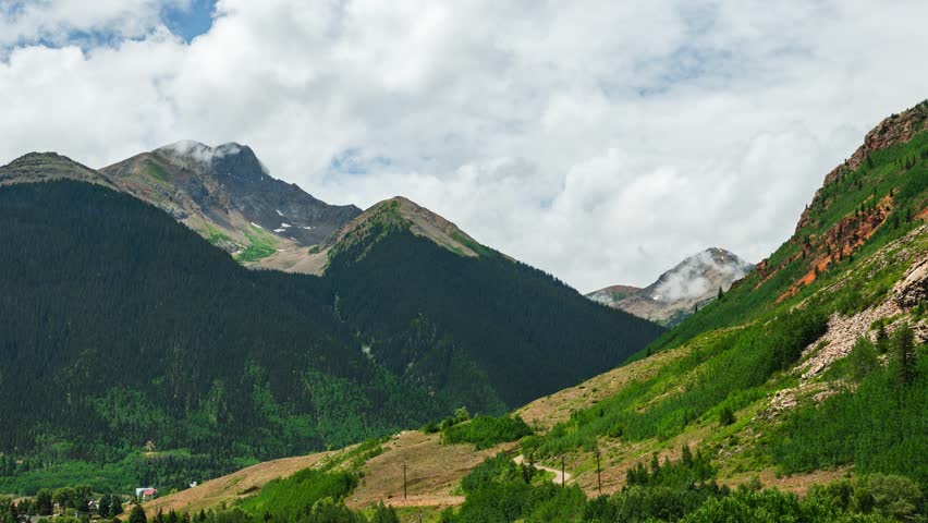 4K Colorado time lapse in Silverton, CO during summer. Clouds after a summer rainstorm moving over the mountains that surround the historic mining town of Silverton in Colorado