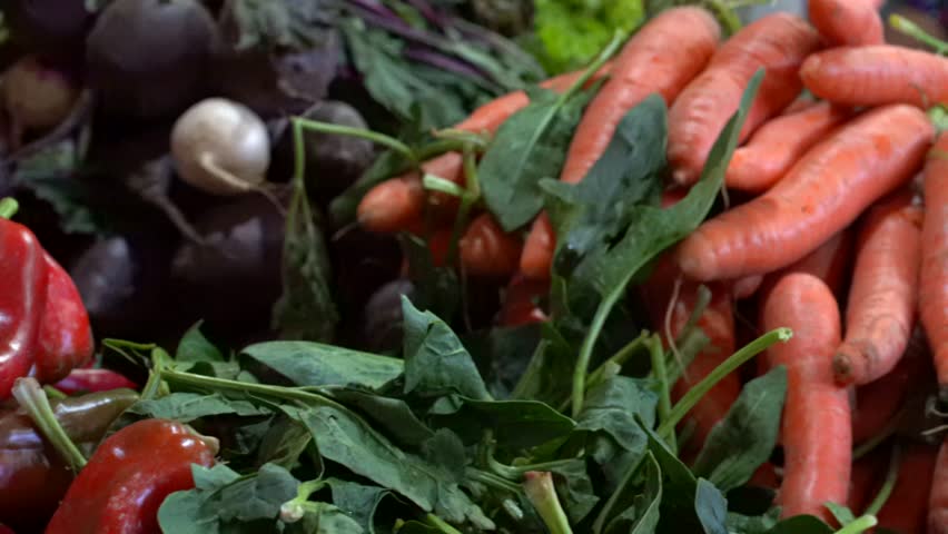 Panning shot of vegetables in market. Latin american market.