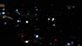 Abstract bokeh of city lights at night. Defocused urban landscape with shimmering, colorful lights. Dark background. - Powered by Shutterstock - Get 15% off with code: PIKWIZARD15