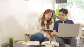Diverse Asian business people working on laptop at cafes, meeting discussion with colleague outside office. Female startup entrepreneur partnership talking collaboration business plan at coffee shop. - Powered by Shutterstock - Get 15% off with code: PIKWIZARD15