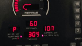 Close-up of a treadmill's digital display showing speed, distance, incline, heart rate, and calories burned during a workout session. - Powered by Shutterstock - Get 15% off with code: PIKWIZARD15