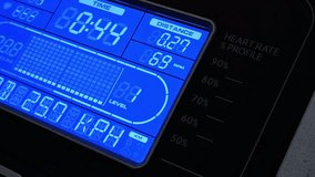 Close-up of a treadmill display showing time, distance, speed, level, and heart rate. Focus on fitness tracking and exercise progress. - Powered by Shutterstock - Get 15% off with code: PIKWIZARD15