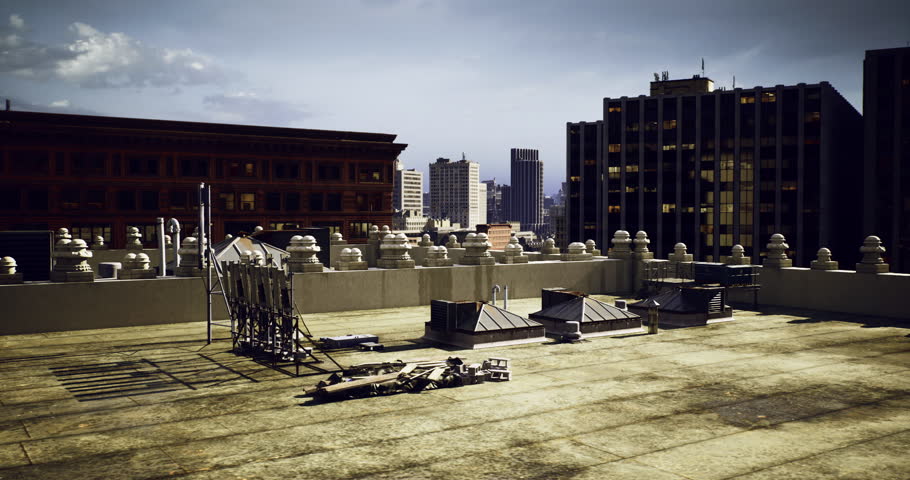 Rooftop space features scattered construction materials against a backdrop of urban skyline. City buildings rise in the distance under a clear blue sky, reflecting midday sunlight.