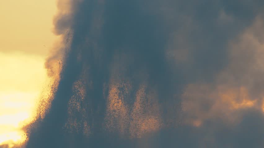 Close up slow motion of Old Faithful geyser in Yellowstone National Park erupting at sunset.