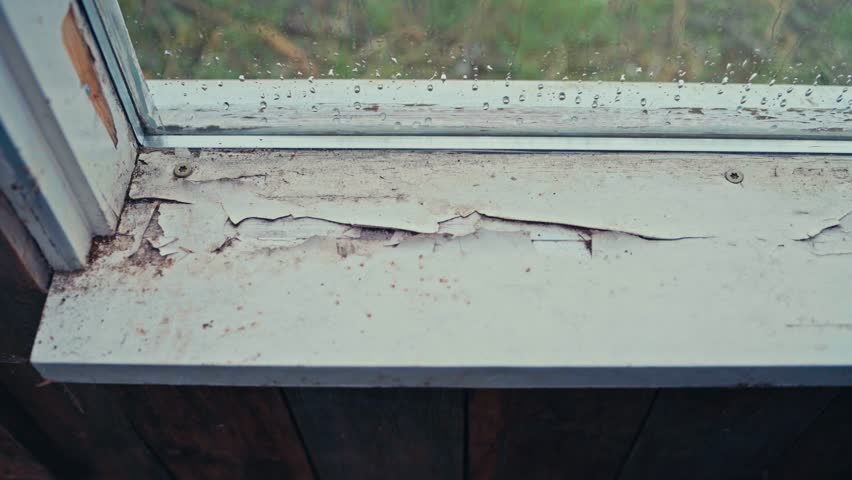 Man Repairing Old Window Sill - Close Up