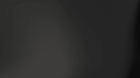 A video showing a smooth, dark black silk fabric gently moving and unveiling, creating an elegant and abstract motion background. - Powered by Shutterstock - Get 15% off with code: PIKWIZARD15