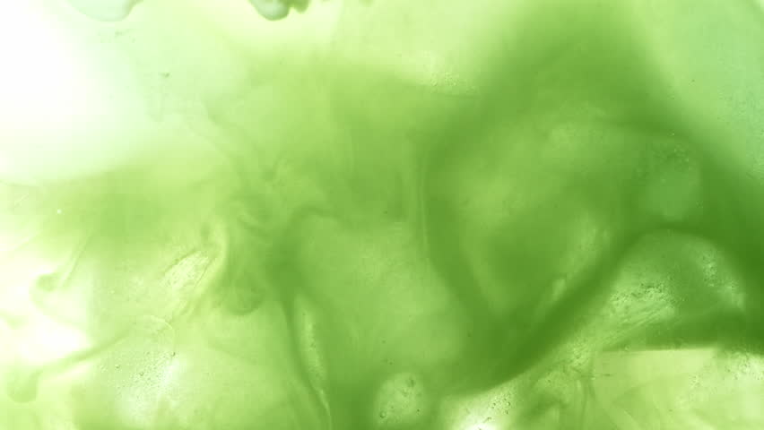 Super Slow Motion Detail Shot of Pouring Cream into Matcha Latte at 1000fps.