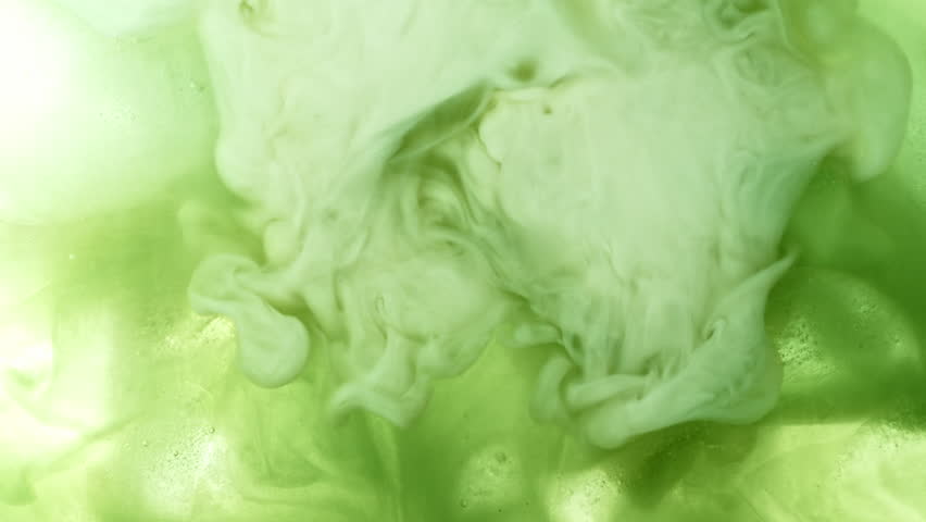 Super Slow Motion Detail Shot of Pouring Cream into Matcha Latte at 1000fps.