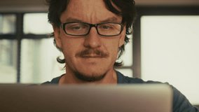 Man Removing Glasses Due to Eye Strain from Laptop - Powered by Shutterstock - Get 15% off with code: PIKWIZARD15