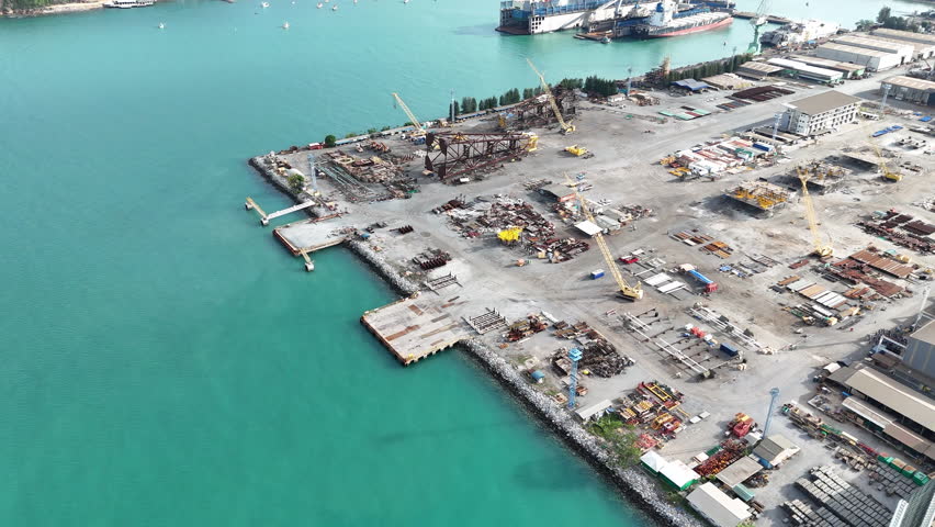 The company assembles large drilling rig structures next to the sea for easy transport onto ships. shipyard for transporting large structures onto ships.