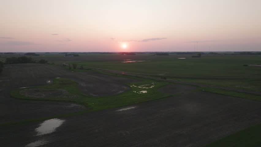 Railroad Track Along The Rural Fields During Sunset. - aerial shot