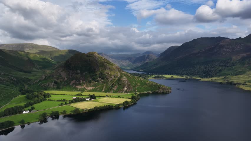 Stunning aerial view over Crummock water with Rannerdale Knotts, the Buttermere valley and sourounding Fells, The Lake District, Cumbria, England.