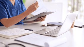 Dedicated healthcare worker performs administrative tasks in a professional medical environment using modern technology tools - Powered by Shutterstock - Get 15% off with code: PIKWIZARD15