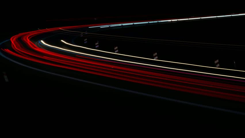 lights of cars driving at night. long exposure