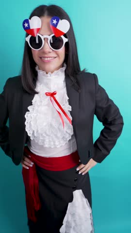 Young woman wearing traditional chilean huasa clothing takes a selfie, celebrating fiestas patrias
