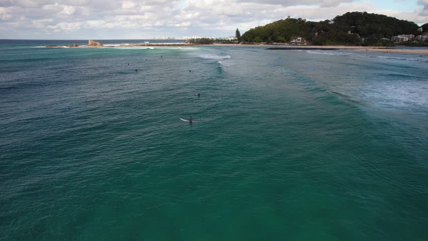 Gold Coast , Queensland , Australia - 07 29 2025: Surfers On The Beaches Near Currumbin Rock In The Gold Coast, Queensland, Australia.