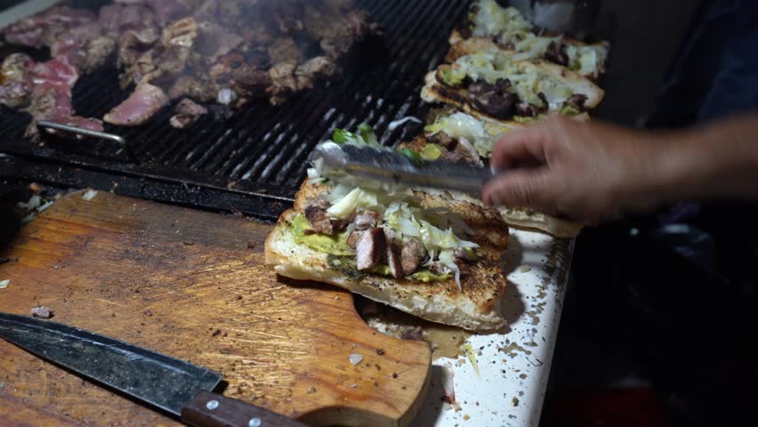 Guatemalan hot dogs made in food stand. Guatemalan shucos.