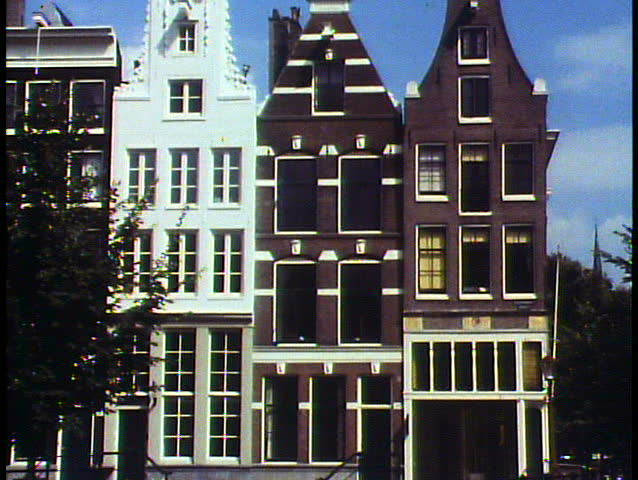 Amsterdam, Holland, The Netherlands, medium shot of three narrow houses, tilt up