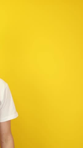 Vertical close-up of two hands pointing at empty yellow background. Ideal for app callouts, UI overlays, ad banners, e-learning modules, product demos, Black Friday and Cyber Monday promotions.