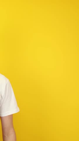 Vertical close-up of two hands pointing at empty yellow background. Ideal for app callouts, UI overlays, ad banners, e-learning modules, product demos, Black Friday and Cyber Monday promotions.