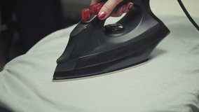 Ironing Shirt On Ironing Board. Household Chore Daily Routine. Domestic Life Housekeeping And Cleaning. Wrinkle-Free Clothes Home Task. Laundry Day. Ironing Process Housewife At Work. Neat And Tidy - Powered by Shutterstock - Get 15% off with code: PIKWIZARD15