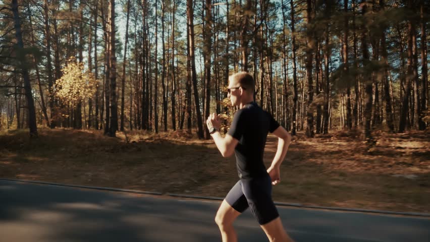 Runner Training Physical Exertion. Athlete Jogging Endurance Sport Activity. Exercise Routine Solo Run. Trail Running. Fitness Cardio Workout. Sportive Figure Runner. Active Living Runner's Stride 