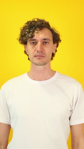 Excited man in white t-shirt mimicking a spyglass with hands, then lowering them and exclaiming WOW — a dynamic visual perfect for Black Friday, Cyber Monday, and seasonal sales campaigns