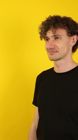 Energetic man shouting Sale, with cupped hands against a vibrant yellow backdrop. Perfect for retail campaigns, Black Friday ads, and promotional marketing visuals.