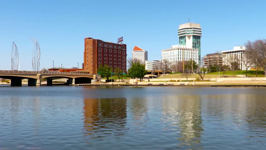 The wichita kansas downtown skyline reflecting in the river on a clear day