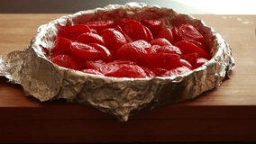 close-up video of cherry tomatoes baking in a tray, perfect for cooking, healthy recipes, and food preparation scenes - Powered by Shutterstock - Get 15% off with code: PIKWIZARD15