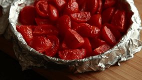 close-up video of cherry tomatoes baking in a tray, perfect for cooking, healthy recipes, and food preparation scenes - Powered by Shutterstock - Get 15% off with code: PIKWIZARD15