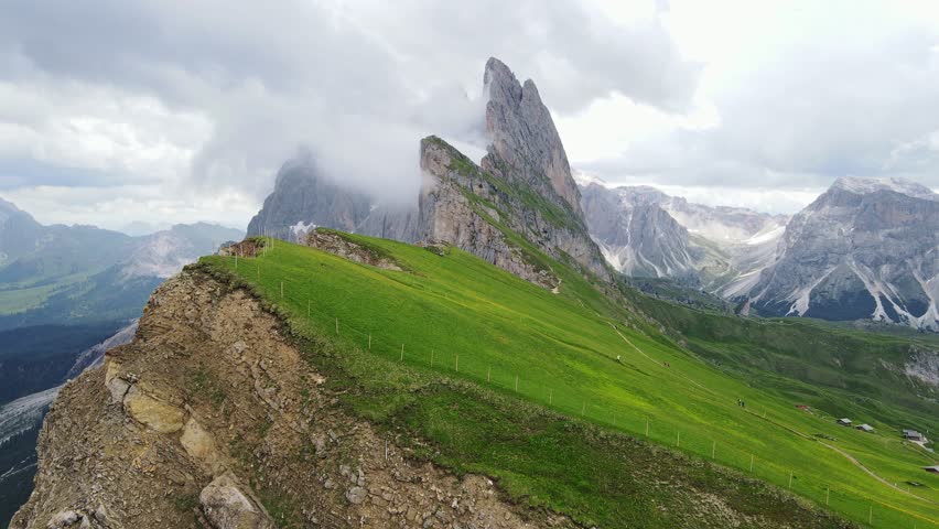 Misty epic contrast unfolds as sun highlights Seceda and Furchetta in Bolzano