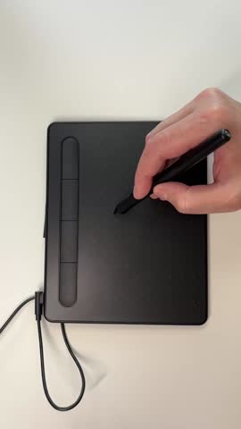 Creative business woman graphic designer working with stylus on digital tablet at modern bright office desk. Freelance artist drawing illustration. Creative professions concept slow motion video