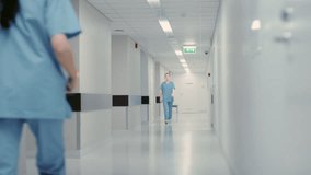 Medical Staff Walk Together Through a Hospital Hallway, Talk about Patient Care and Treatment Plans, Clinical Surgery. Modern Healthcare Facility - Powered by Shutterstock - Get 15% off with code: PIKWIZARD15