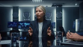 Female Corporate Executive Leads a Discussion With Colleagues in Conference Room, Explore Digital Charts and Global Data on Monitors While Team Members Take Notes and Analyze Financial - Powered by Shutterstock - Get 15% off with code: PIKWIZARD15