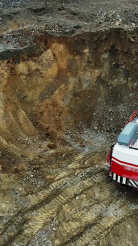 Excavator digging in open pit mine. Stock clip