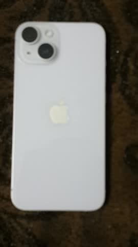 Cairo, Egypt, July, 26, 2025, Awhite iPhone with three rear lenses on a brown background. 