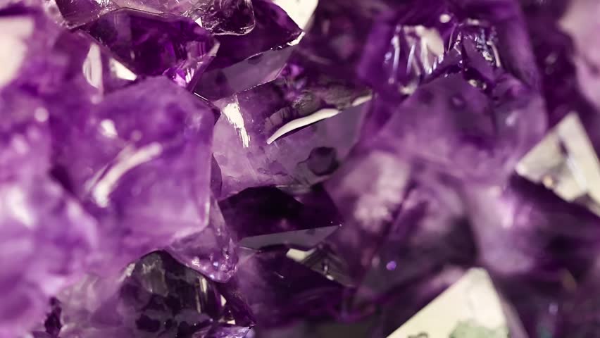 Intricate Purple Crystal Formation Revealing Inner Light