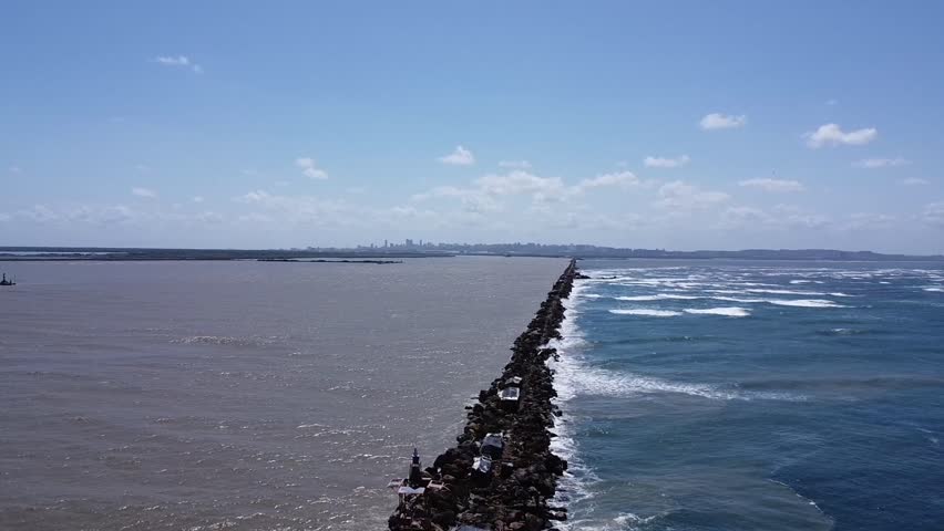 Drone shot over Bocas de Ceniza outside the city of Barranquilla, Colombia, intersection of Atlantic Ocean and Magdalena River