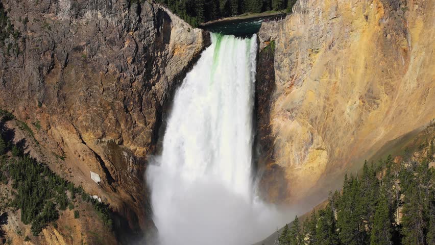 Lower Yellowstone Falls waterfall in the Grand Canyon of Yellowstone. Yellowstone National Park, Wyoming, USA. Vertical video mobile format portrait orientation. Canyon river and mountain