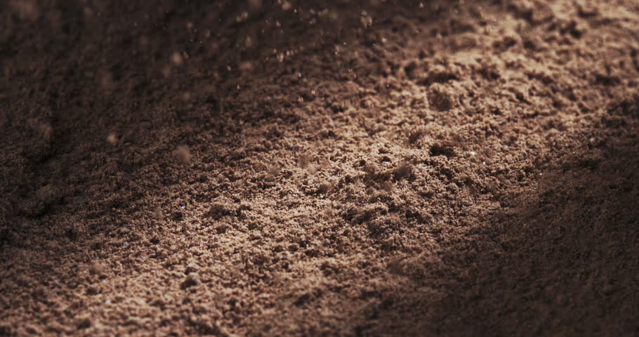 Cocoa Powder Cascading In Slow Motion, Creating A Fluffy And Rich Texture Over A Dark Background, Captured In Extreme Close-Up For A Delicious And Visual Gourmet Ingredient Experience at 1000 fps.