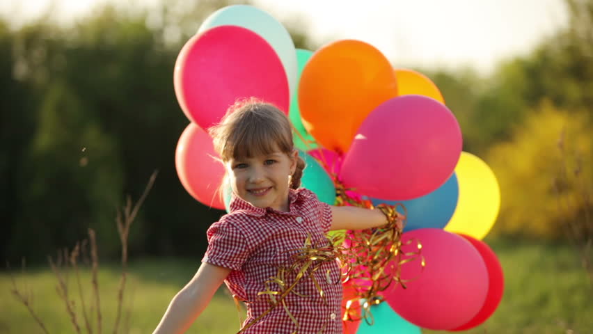 Child with balloons in the park
