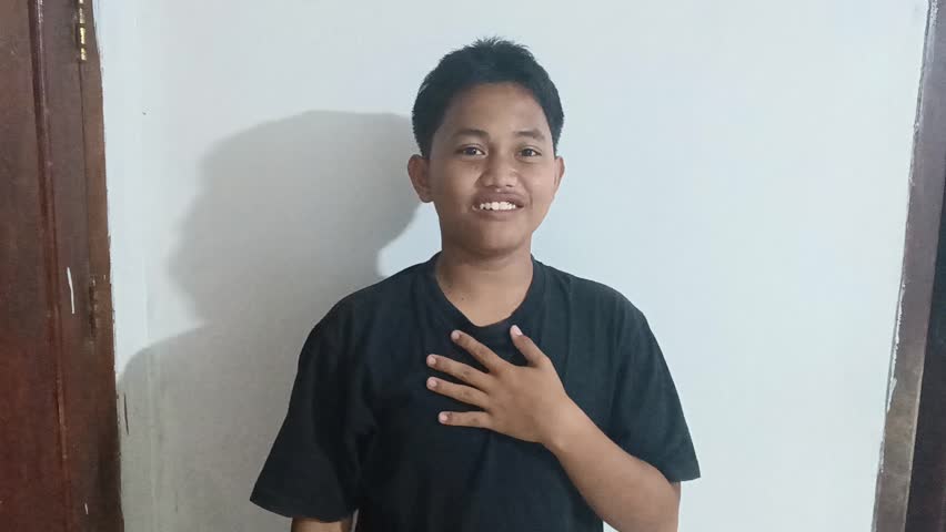 Welcome and Heartfelt Thank You Gesture by a Sincere Young Man