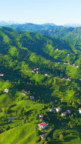 Vertical video. Ardeshen, Turkey. Panorama of green mountains. Firtina River Valley. Sunny morning, Aerial View. Rich colors
