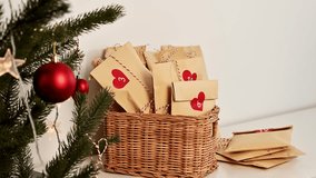 christmas eco-friendly advent calendar idea. craft bags with little surprises inside near decorated fur tree - Powered by Shutterstock - Get 15% off with code: PIKWIZARD15