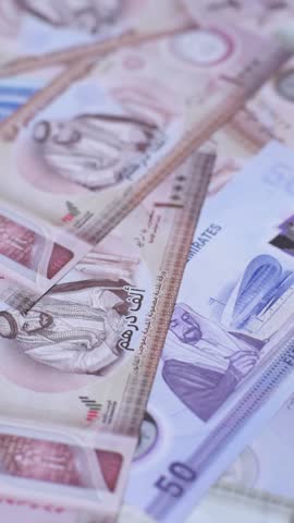 UAE money, dirham, paper banknotes, cash. Emirates money for doing business, travelling