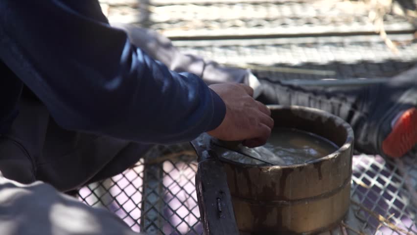 A craftsman sharpening pruning shears
