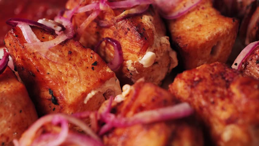 Tasty dish barbecue of chicken with onion on plate. Skewer beef. Grilling marinated shashlik souvlaki. High quality 4k footage